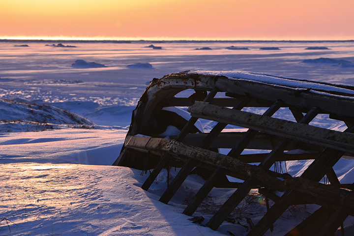 Native boat frame in snow in Alaska.